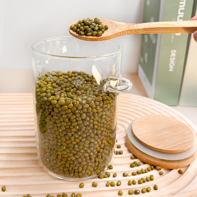 Makanan Botol Bambu Kaca Bulat Dengan Tutup Dan Sapi Permen Rempah Kopi Kacang Kacang Kue
